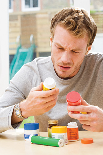 man reading medicine label copy.jpg